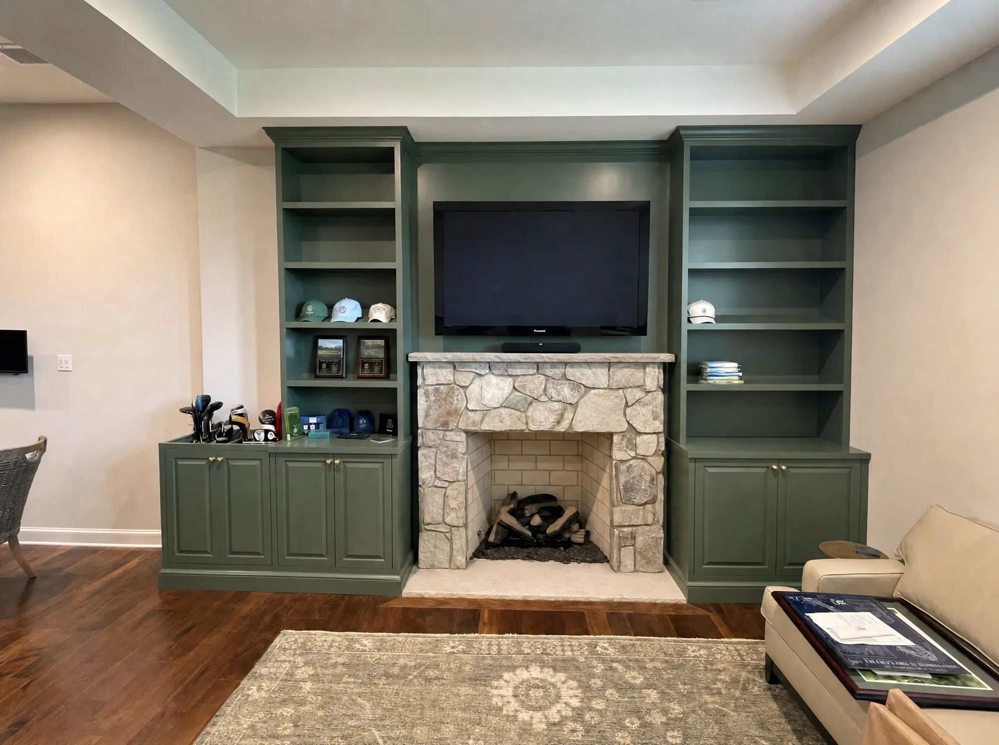 After: Living room before and after custom built-ins around a stone fireplace, Rockville MD