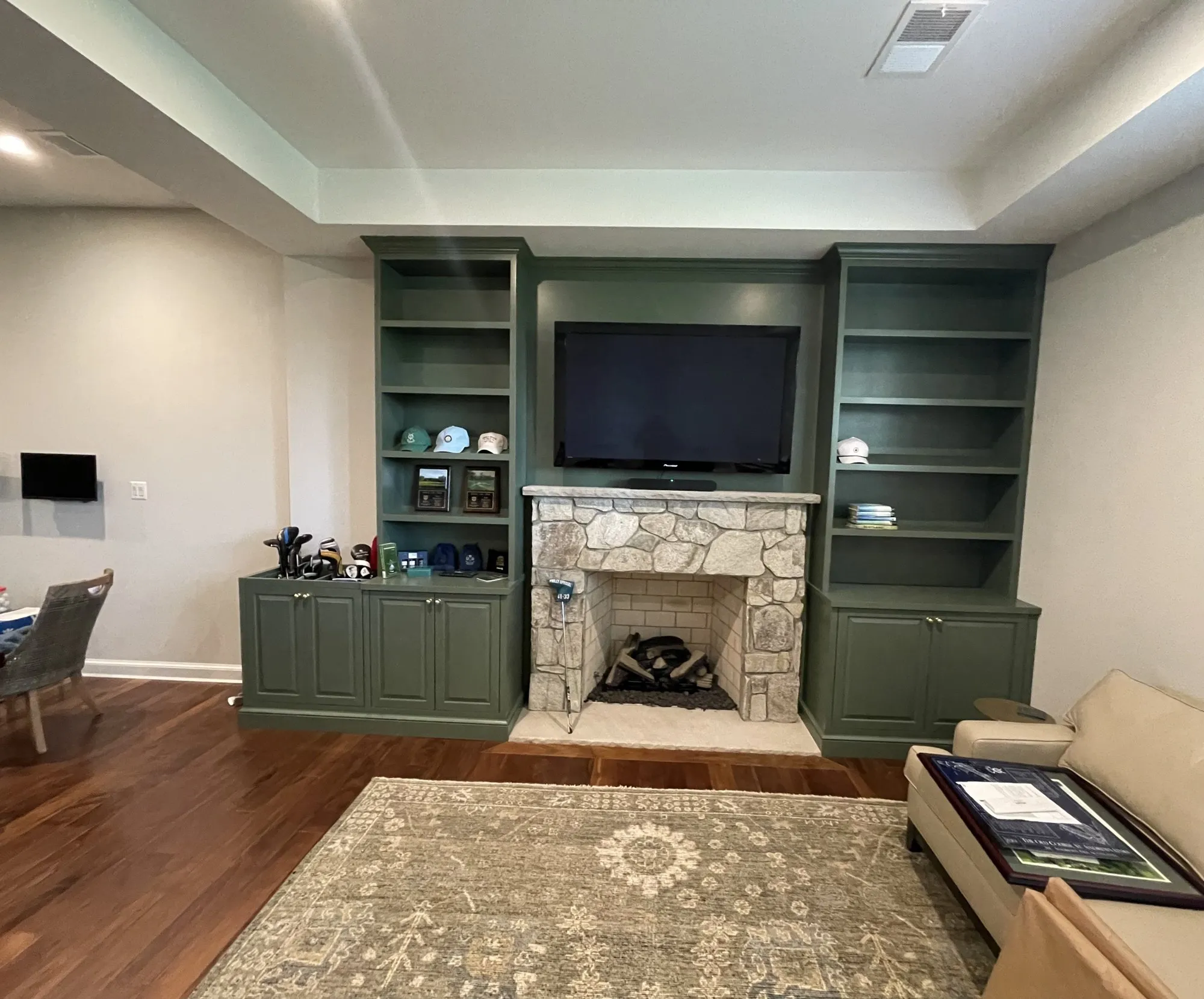 After: Living-room built-ins around a stone fireplace, Montgomery County