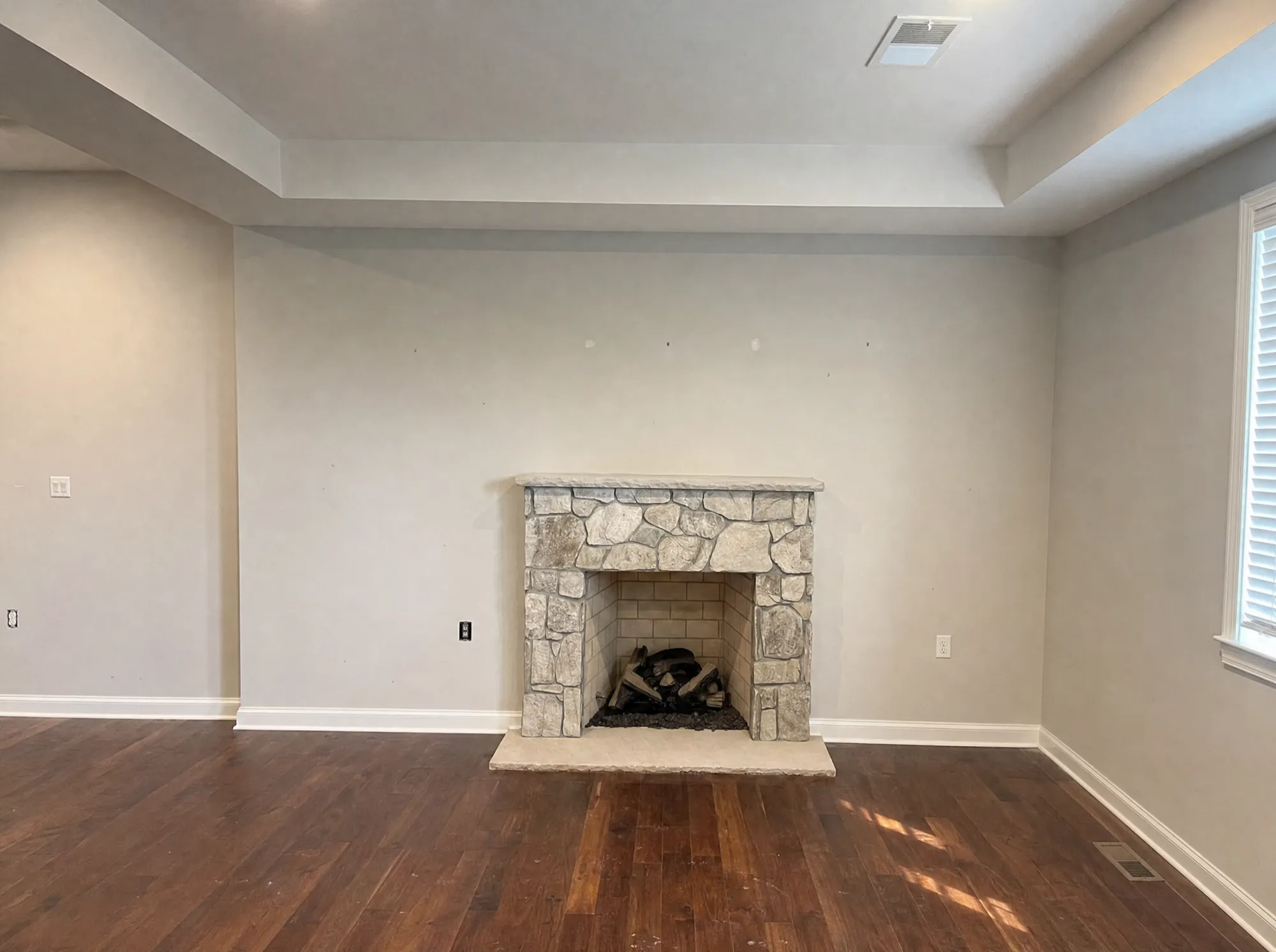 Before: Living-room built-ins around a stone fireplace, Montgomery County