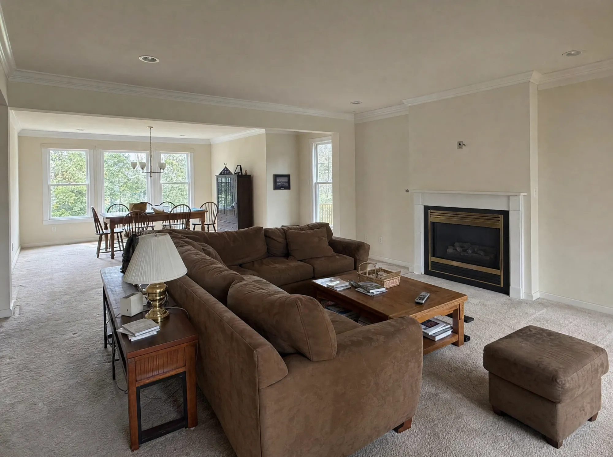 Before: Living room before and after a remodel with custom built-ins and hardwood floors, Rockville MD