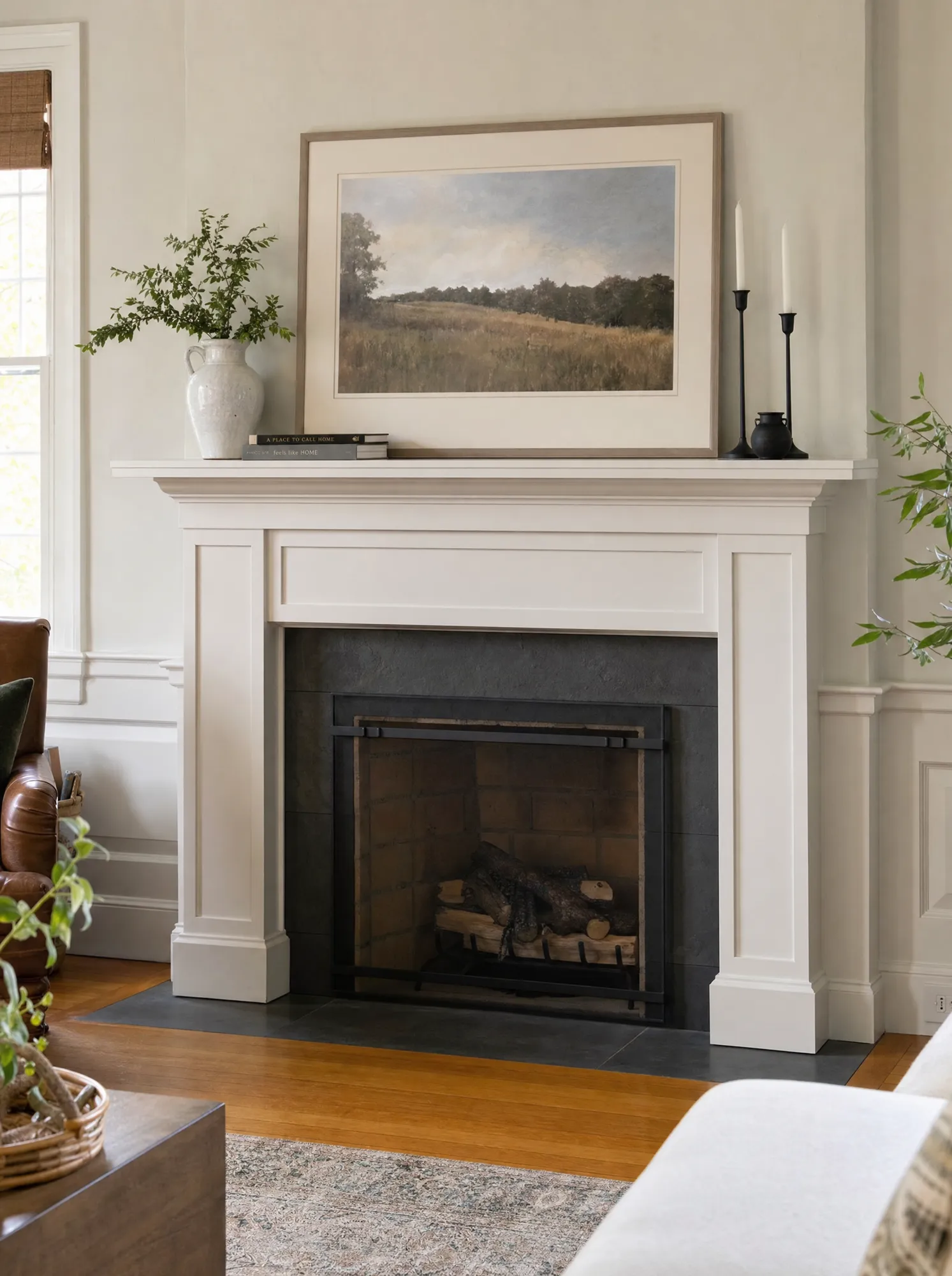Remodeled living-room fireplace with a custom painted-wood mantel and shaker surround by Fogg Carpentry