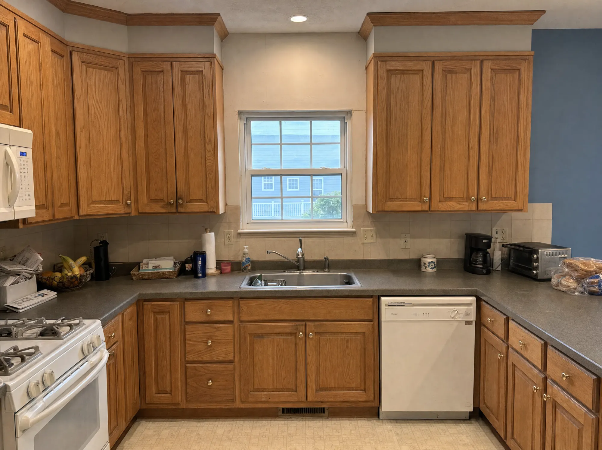 Before: Kitchen before and after a full remodel with new cabinetry and an island, Rockville MD