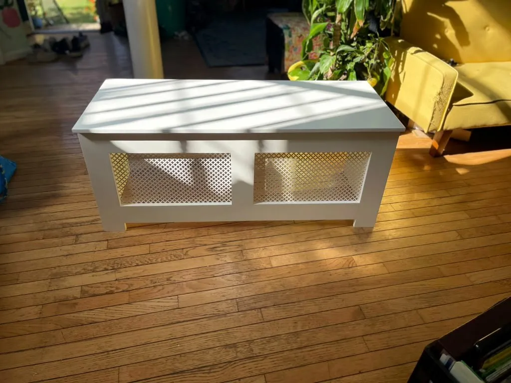 Custom white radiator bench cover with lattice grilles by Fogg Carpentry